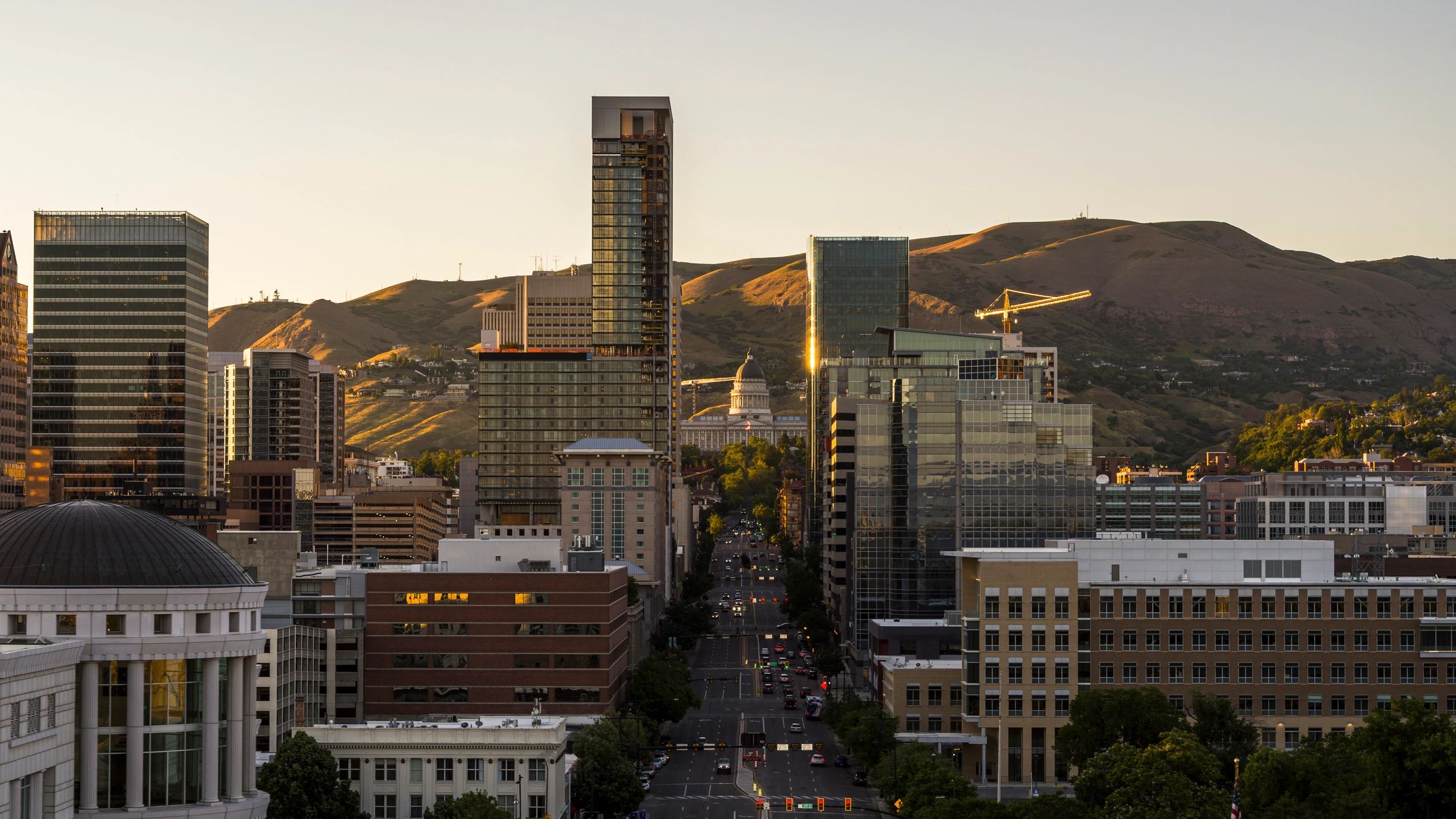 Downtown Salt Lake City skyline at sunset with mountains in the background