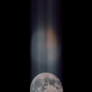 moon fine art print with vertical light streaks rising above the moon