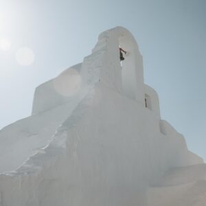 Mykonos church fine art print showing white bell tower against blue sky